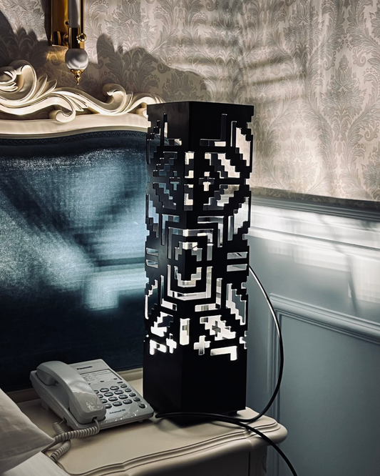 metal floor lamp with RGB LED lighting and laser cut pattern glowing in dark modern interior