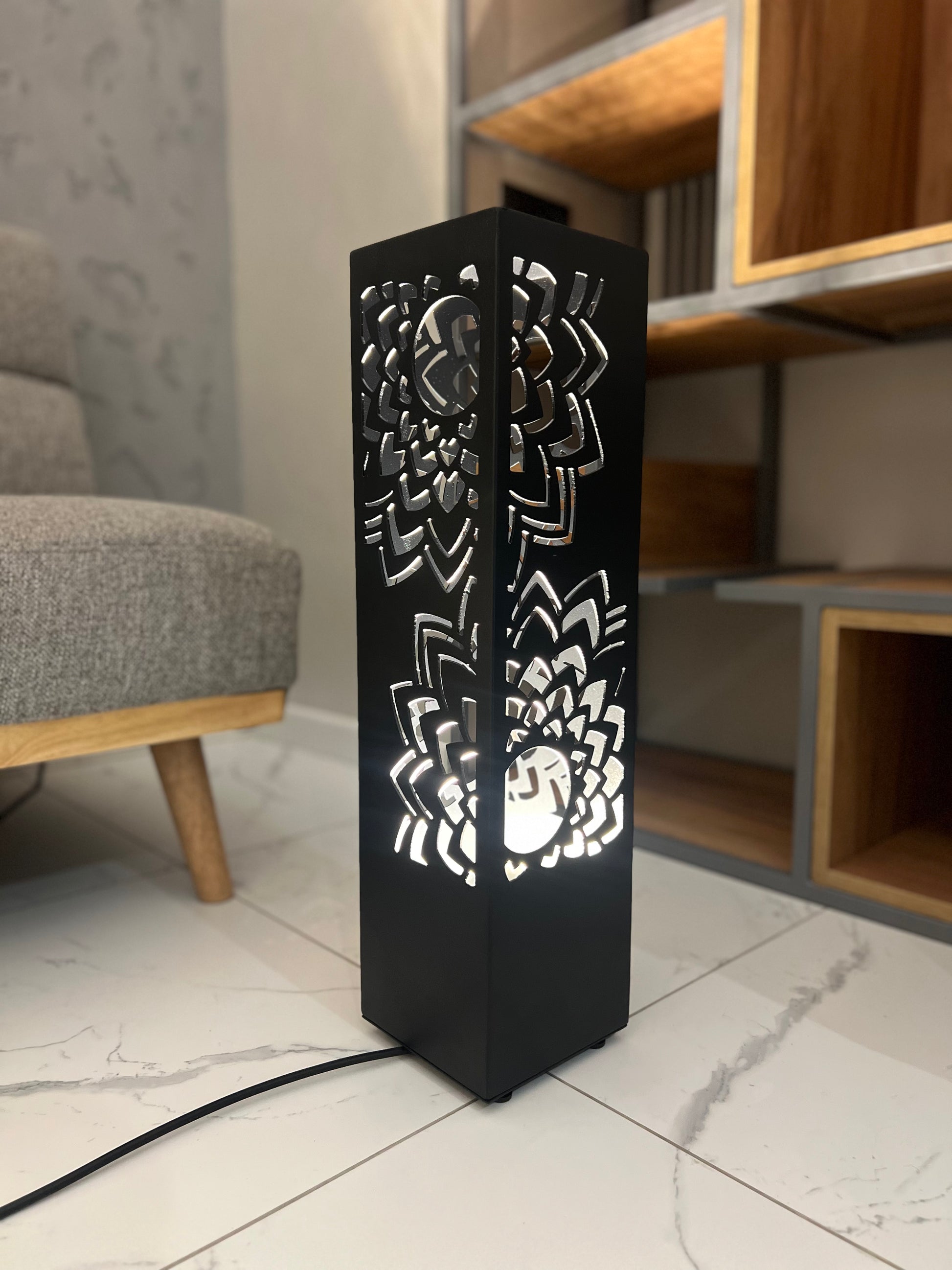 modern standing metal lamp with multicolor LED lighting and decorative cutout design