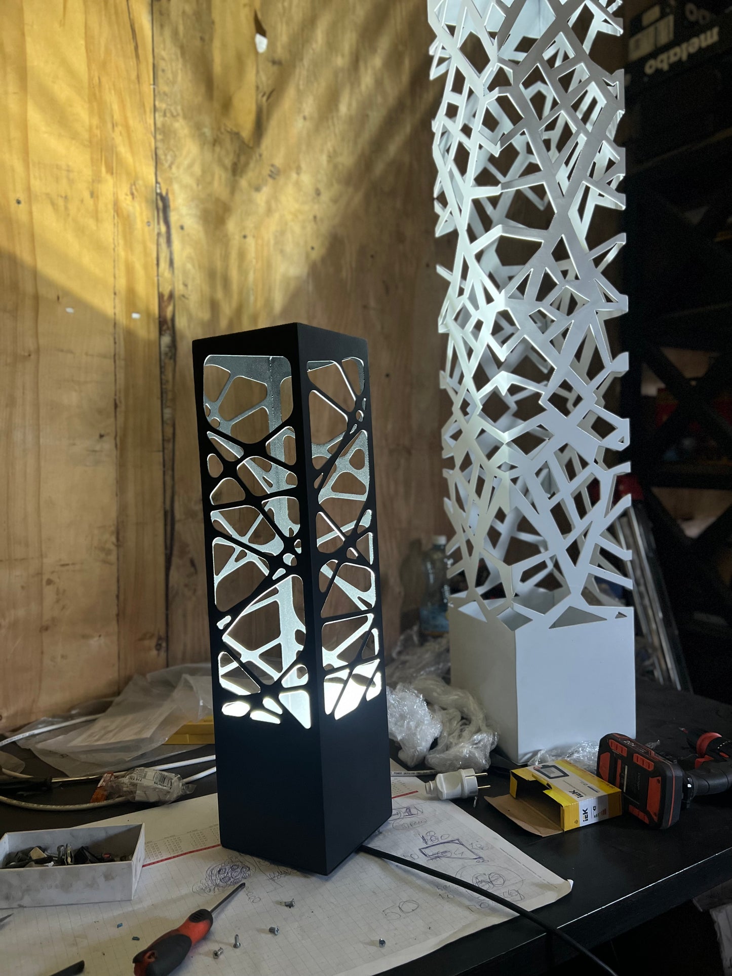 laser cut metal floor lamp with intricate pattern and vibrant RGB illumination