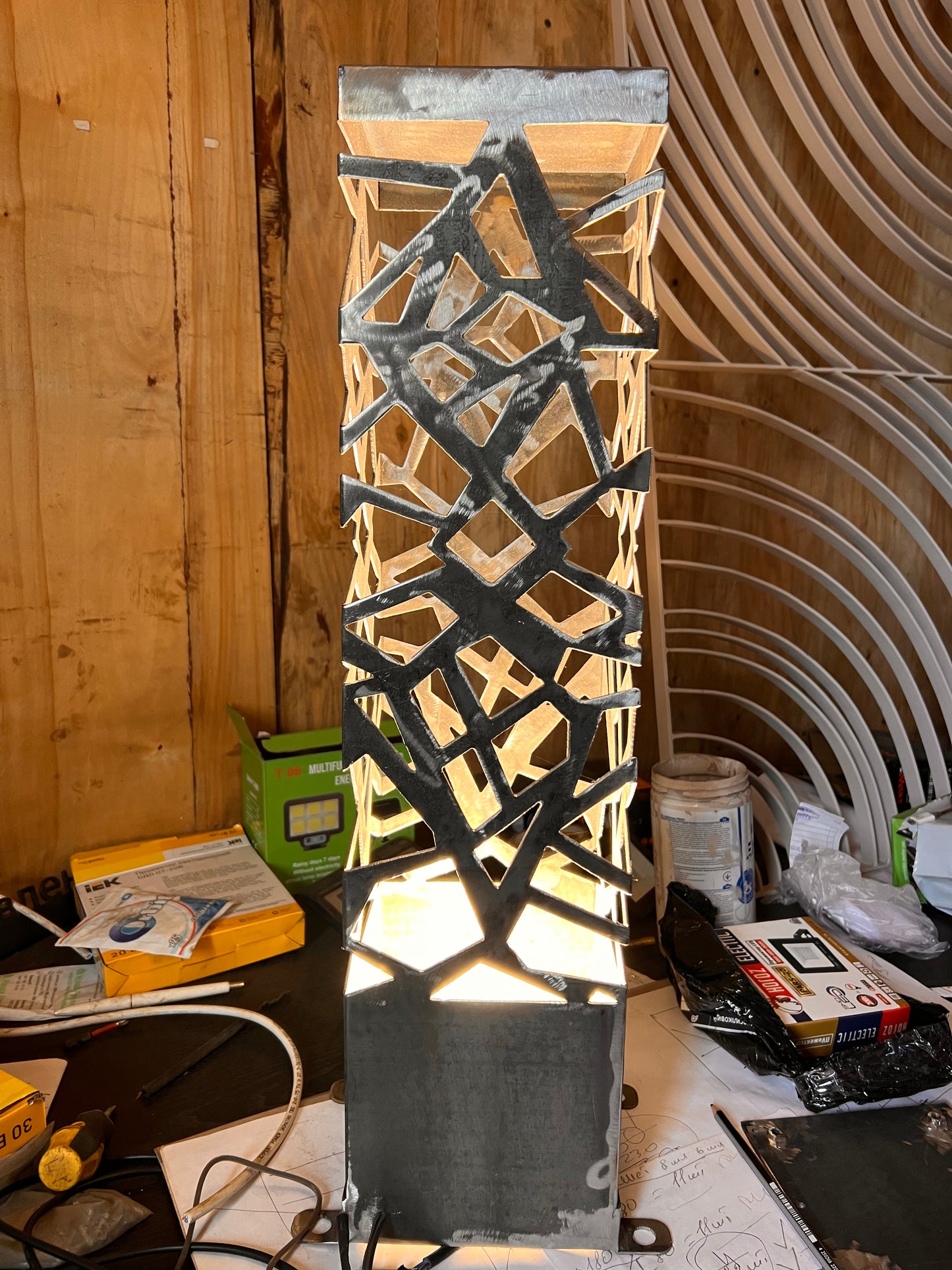 ambient LED floor lamp with geometric shadows and color changing light effect