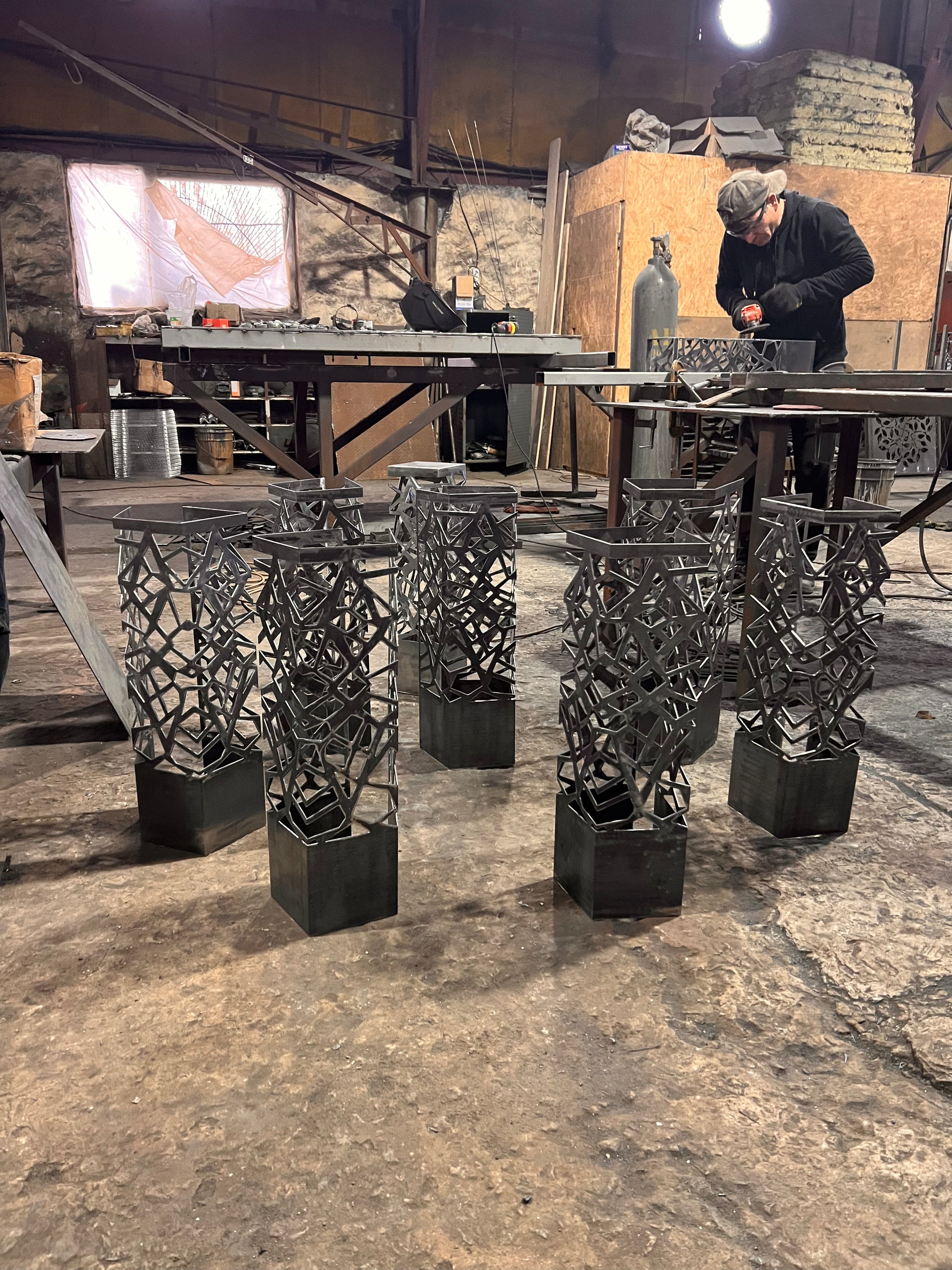 tall metal floor lamp with color changing LED and elegant laser cut details while production process