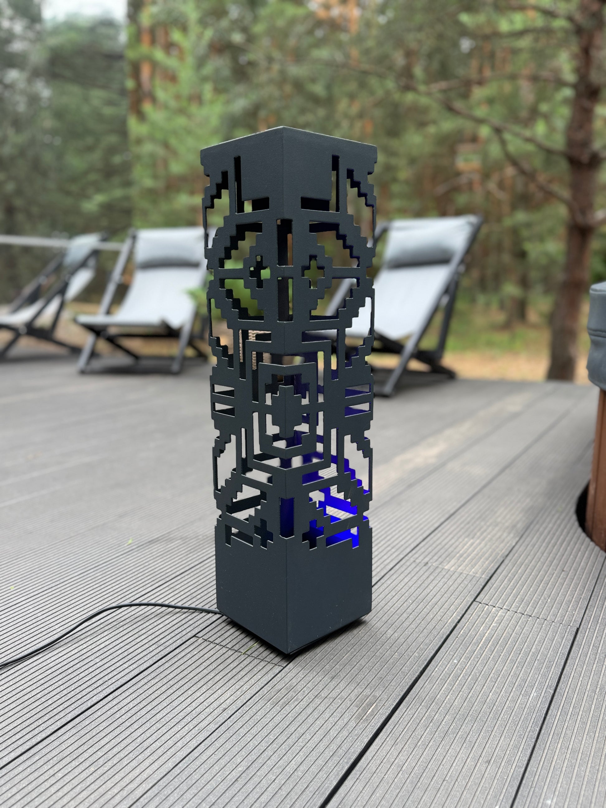 laser cut metal outdoor lamp with patterned light effect design